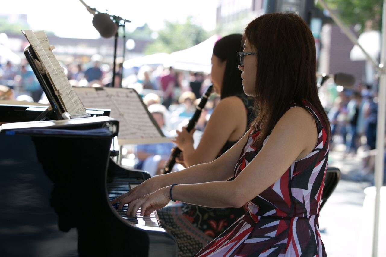 Two musicians performing live at a festival